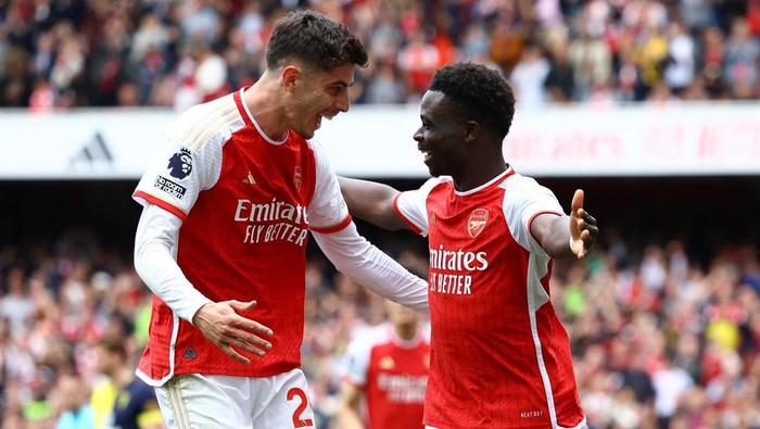 Bukayo Saka Soccer Football - Premier League - Arsenal v AFC Bournemouth - Emirates Stadium, London, Britain - May 4, 2024 Arsenals Bukayo Saka celebrates scoring their first goal with Kai Havertz Action Images via Reuters/Paul Childs NO USE WITH UNAUTHORIZED AUDIO, VIDEO, DATA, FIXTURE LISTS, CLUB/LEAGUE LOGOS OR LIVE SERVICES. ONLINE IN-MATCH USE LIMITED TO 45 IMAGES, NO VIDEO EMULATION. NO USE IN BETTING, GAMES OR SINGLE CLUB/LEAGUE/PLAYER PUBLICATIONS.