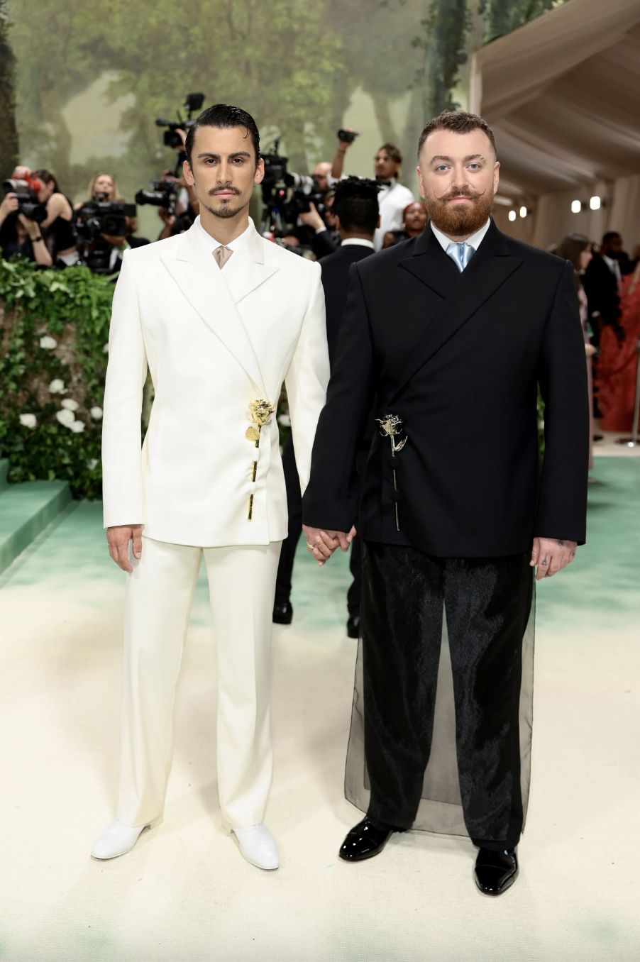 Sam Smith and partner Christian Cowan in coordinated suits at the 2024 Met Gala