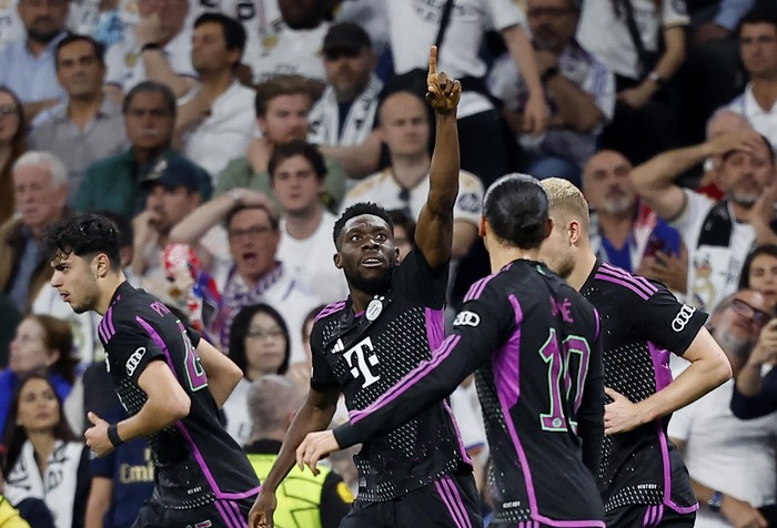 Soccer Football - Champions League - Semi Final - Second Leg - Real Madrid v Bayern Munich - Santiago Bernabeu, Madrid, Spain - May 8, 2024 Bayern Munich's Alphonso Davies celebrates scoring their first goal REUTERS/Juan Medina