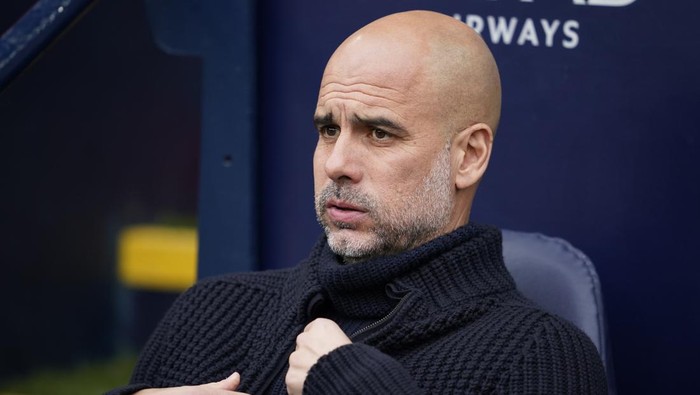 Manchester Citys head coach Pep Guardiola sits on the bench before the English Premier League soccer match between Manchester City and Wolverhampton Wanderers at the Etihad Stadium in Manchester, England, Saturday, May 4, 2024. (AP Photo/Dave Thompson)