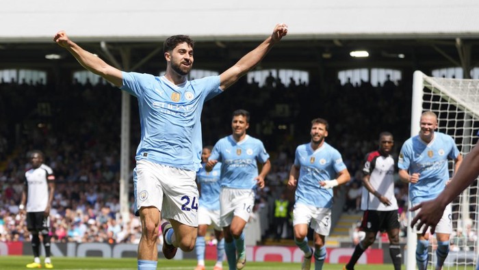 Manchester Citys Josko Gvardiol celebrates after scoring his sides third goal during the English Premier League soccer match between Fulham and Manchester City at the Craven Cottage Stadium in London, Saturday, May 11, 2024. (AP Photo/Kirsty Wigglesworth)