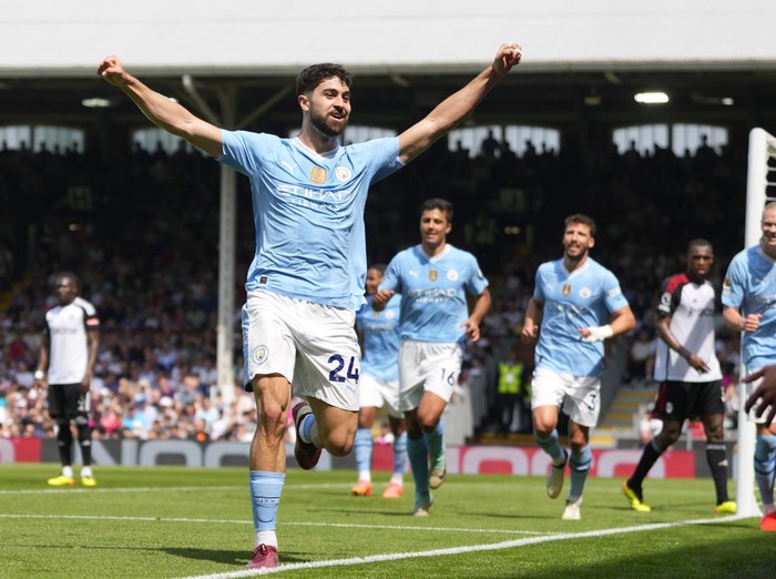 Manchester City's Josko Gvardiol celebrates after scoring his side's third goal during the English Premier League soccer match between Fulham and Manchester City at the Craven Cottage Stadium in London, Saturday, May 11, 2024. (AP Photo/Kirsty Wigglesworth)