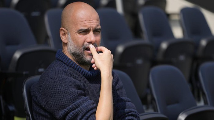 Manchester Citys head coach Pep Guardiola waits for the start of the English Premier League soccer match between Fulham and Manchester City at the Craven Cottage Stadium in London, Saturday, May 11, 2024. (AP Photo/Kirsty Wigglesworth)