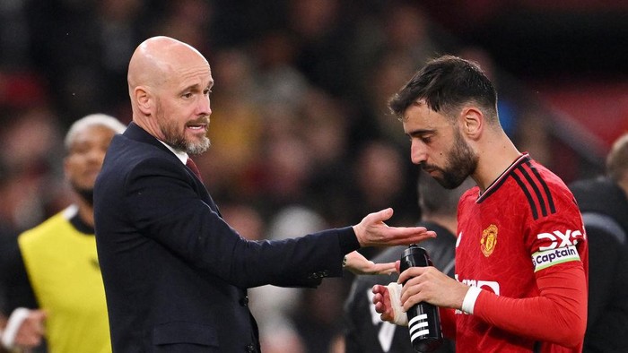 MANCHESTER, ENGLAND - MAY 15: Erik ten Hag speaks to Bruno Fernandes of Manchester United during the Premier League match between Manchester United and Newcastle United at Old Trafford on May 15, 2024 in Manchester, England. (Photo by Stu Forster/Getty Images)