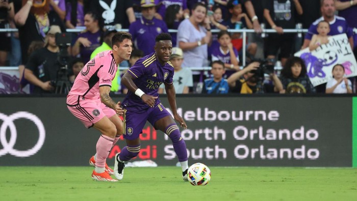 May 15, 2024; Orlando, Florida, USA; Orlando City forward Ivan Angulo (77) plays the ball defend by Inter Miami defender Franco Negri (33) in the first half at Inter&Co Stadium. Mandatory Credit: Kim Klement Neitzel-USA TODAY Sports