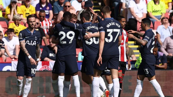 Tottenham Hotspurs Croatian midfielder #14 Ivan Perisic (not seen) celebrates with his team after scoring the opening goal during the English Premier League football match between Sheffield United and Tottenham Hotspur at Bramall Lane in Sheffield, northern England on May 19, 2024. (Photo by Darren Staples / AFP) / RESTRICTED TO EDITORIAL USE. No use with unauthorized audio, video, data, fixture lists, club/league logos or live services. Online in-match use limited to 120 images. An additional 40 images may be used in extra time. No video emulation. Social media in-match use limited to 120 images. An additional 40 images may be used in extra time. No use in betting publications, games or single club/league/player publications. /