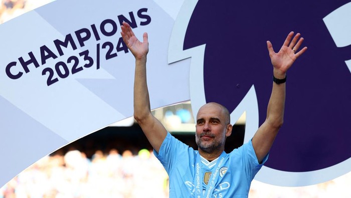 Soccer Football - Premier League - Manchester City v West Ham United - Etihad Stadium, Manchester, Britain - May 19, 2024  Manchester City manager Pep Guardiola celebrates after winning the Premier League REUTERS/Molly Darlington EDITORIAL USE ONLY. NO USE WITH UNAUTHORIZED AUDIO, VIDEO, DATA, FIXTURE LISTS, CLUB/LEAGUE LOGOS OR LIVE SERVICES. ONLINE IN-MATCH USE LIMITED TO 120 IMAGES, NO VIDEO EMULATION. NO USE IN BETTING, GAMES OR SINGLE CLUB/LEAGUE/PLAYER PUBLICATIONS. PLEASE CONTACT YOUR ACCOUNT REPRESENTATIVE FOR FURTHER DETAILS..