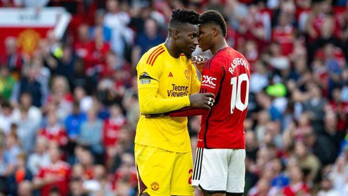 MANCHESTER, ENGLAND - OCTOBER 07: Andre Onana and Marcus Rashford of Manchester United interact following their sides victory in the Premier League match between Manchester United and Brentford FC at Old Trafford on October 07, 2023 in Manchester, England. (Photo by Ash Donelon/Manchester United via Getty Images)