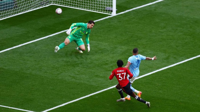 LONDON, ENGLAND - MAY 25: Kobbie Mainoo of Manchester United scores his teams second goal during the Emirates FA Cup Final match between Manchester City and Manchester United at Wembley Stadium on May 25, 2024 in London, England. (Photo by Ben Hoskins - The FA/The FA via Getty Images)