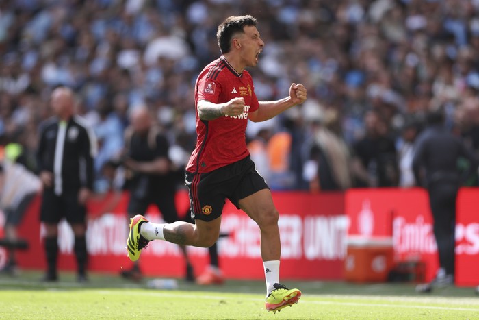 Manchester Uniteds Lisandro Martinez celebrates after winning the English FA Cup final soccer match between Manchester City and Manchester United at Wembley Stadium in London, Saturday, May 25, 2024. (AP Photo/Ian Walton)