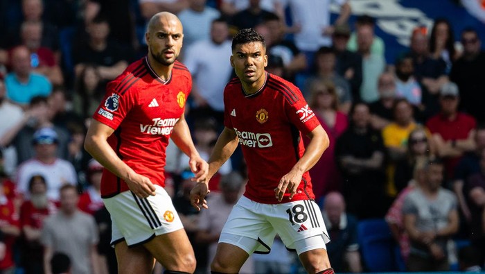 BRIGHTON, ENGLAND - MAY 19: Sofyan Amrabat and Casemiro of Manchester United in action during the Premier League match between Brighton & Hove Albion and Manchester United at American Express Community Stadium on May 19, 2024 in Brighton, England. (Photo by Ash Donelon/Manchester United via Getty Images)