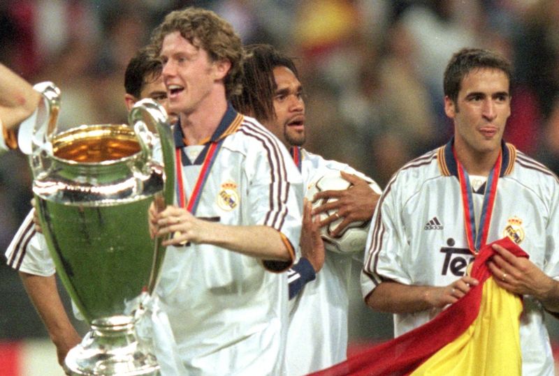 Steve McManaman 24 May 2000: Steve McManaman of Real Madrid holds the trophy while celebrating with the other players after the European Champions League Final 2000 against Valencia at the Stade de France, Saint-Denis, France. Real Madrid won 3-0. Mandatory Credit: Graham Chadwick /Allsport