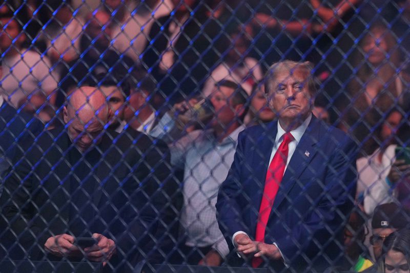 donald trump ufc 302 ufc sean strickland vs paulo costa Jun 1, 2024; Newark, New Jersey, USA; Former president Donald Trump attends the fight between Sean Strickland (red gloves) and Paulo Costa (blue gloves) during UFC 302 at Prudential Center. Mandatory Credit: Joe Camporeale-USA TODAY Sports