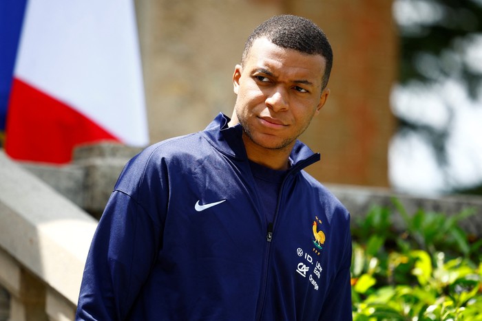 French soccer player Kylian Mbappe waits for the arrival of French President Emmanuel Macron for a lunch at their training camp ahead of the UEFA Euro 2024, in Clairefontaine-en-Yvelines, France, June 3, 2024. REUTERS/Sarah Meyssonnier/Pool