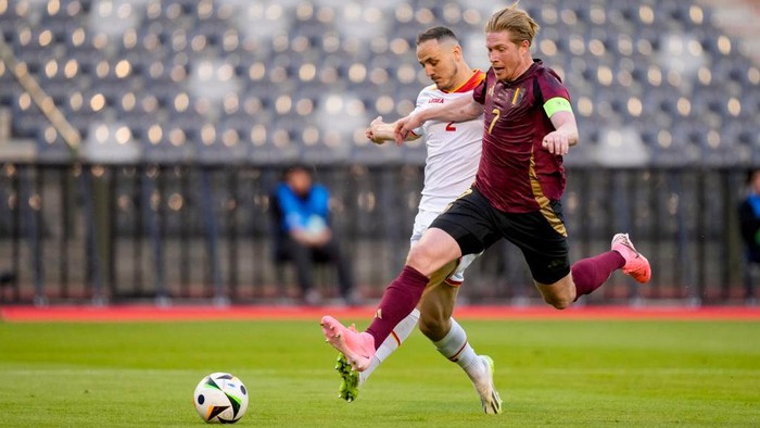 BRUSSELS, BELGIUM - JUNE 5: Andrija Vukcevic of Montenegro and Kevin De Bruyne of Belgium battle for the ball during the International Friendly match between Belgium and Montenegro at King Baudouin Stadium on June 5, 2024 in Brussels, Belgium. (Photo by Alex Gottschalk/DeFodi Images via Getty Images)