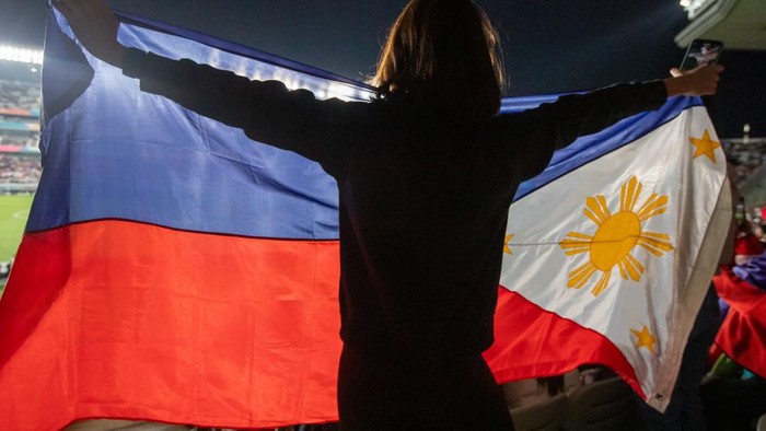 AUCKLAND, NEW ZEALAND - JULY 30: A Philippines fan waves a Philippines flag during a FIFA Womens World Cup Australia and New Zealand 2023 Group A match between Philippines and Norway at Eden Park on July 30, 2023 in Auckland, New Zealand. (Photo by Doug Zimmerman/ISI Photos/Getty Images)