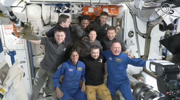 This screengrab from NASA shows astronaut Suni Williams (seated L) and Butch Wilmore (seated R) posing with the crew of the International Space Station (ISS) after the docking of the SpaceX Starship on June 6, 2024. A Boeing Starliner capsule carrying its first ever NASA astronauts docked with the International Space Station on Thursday after overcoming some challenges affecting its propulsion system. (Photo by Handout / NASA / AFP) / RESTRICTED TO EDITORIAL USE - MANDATORY CREDIT 