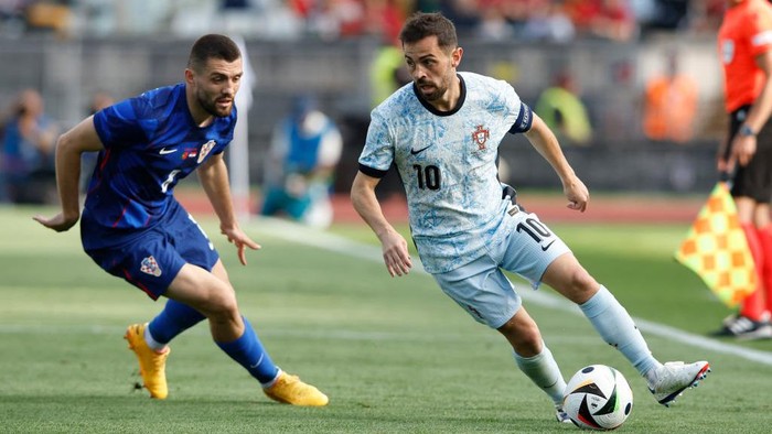 LISBON, PORTUGAL - JUNE 8: Bernardo Silva of Portugal, Mateo Kovacic of Croatia battle for the ball during the International Friendly match between Portugal and Croatia at Estadio Nacional do Jamor on June 8, 2024 in Lisbon, Portugal. (Photo by Joao Rico/DeFodi Images via Getty Images)