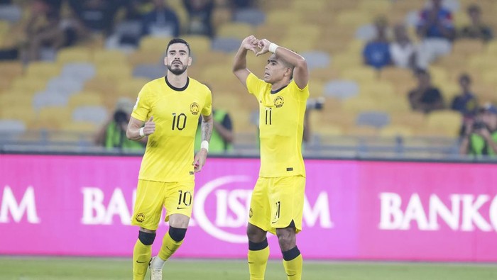 Malaysias Safawi Rasid, left, reacts after scoring the first goal during a 2026 FIFA World Cup qualifying soccer group D match between Malaysia and Taiwan in Bukit Jalil Stadium in Kuala Lumpur, Malaysia, Tuesday, June 11, 2024. (AP Photo/Vincent Thian)