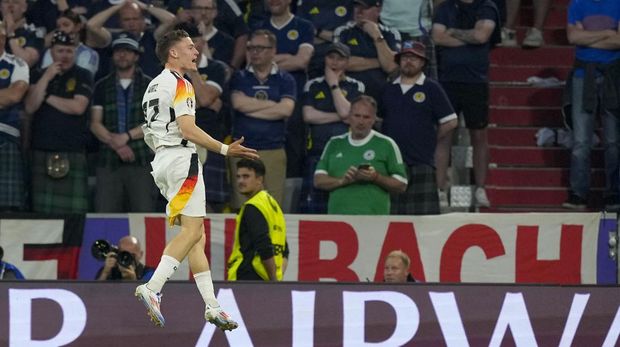 Germany's Florian Wirtz celebrates after scoring opening goal during a Group A match between Germany and Scotland at the Euro 2024 soccer tournament in Munich, Germany, Friday, June 14, 2024. (AP Photo/Antonio Calanni)