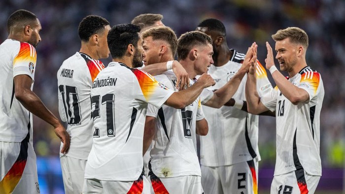 MUNICH, GERMANY - JUNE 14: The team of Germany with Jonathan Tah, Jamal Musiala, Ilkay Guendogan, Joshua Kimmich, Florian Wirtz and Maximilian Mittelstaedt (L-R) celebrate their first goal during the UEFA EURO 2024 group stage match between Germany and Scotland at Munich Football Arena on June 14, 2024 in Munich, Germany. (Photo by Markus Gilliar - GES Sportfoto/Getty Images)