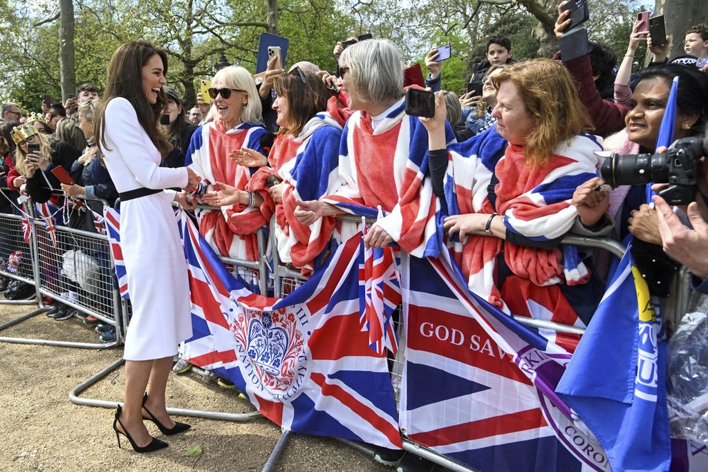 Britain's Kate, Princess of Wales, greets well-wishers outside Buckingham Palace, in London, Friday, May 5, 2023 a day before the coronation of King Charles III and Camilla, Queen Consort, at Westminster Abbey. (Toby Melville, Pool via AP)