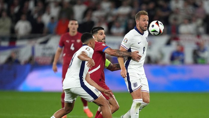 Serbias Aleksandar Mitrovic pulls back on Englands Harry Kane during the UEFA Euro 2024 Group C match at the Arena AufSchalke in Gelsenkirchen, Germany. Picture date: Sunday June 16, 2024. (Photo by Martin Rickett/PA Images via Getty Images)