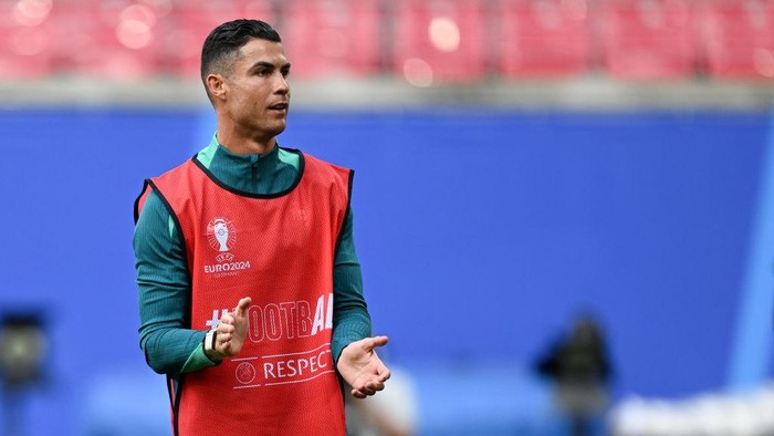 17 June 2024, Saxony, Leipzig: Soccer, UEFA Euro 2024, European Championship, Group F, final training Portugal, Portugals Cristiano Ronaldo reacts on the pitch. Photo: Hendrik Schmidt/dpa (Photo by Hendrik Schmidt/picture alliance via Getty Images)