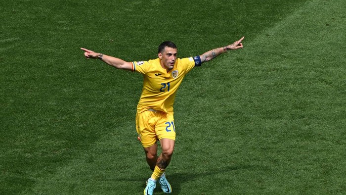 MUNICH, GERMANY - JUNE 17: Nicolae Stanciu of Romania celebrates scoring his teams first goal during the UEFA EURO 2024 group stage match between Romania and Ukraine at Munich Football Arena on June 17, 2024 in Munich, Germany. (Photo by Shaun Botterill/Getty Images)