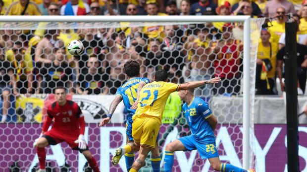 MUNICH, GERMANY - JUNE 17: Nicolae Stanciu of Romania scores the opening goal during the UEFA EURO 2024 group stage match between Romania and Ukraine at Munich Football Arena on June 17, 2024 in Munich, Germany. (Photo by Catherine Ivill - AMA/Getty Images)