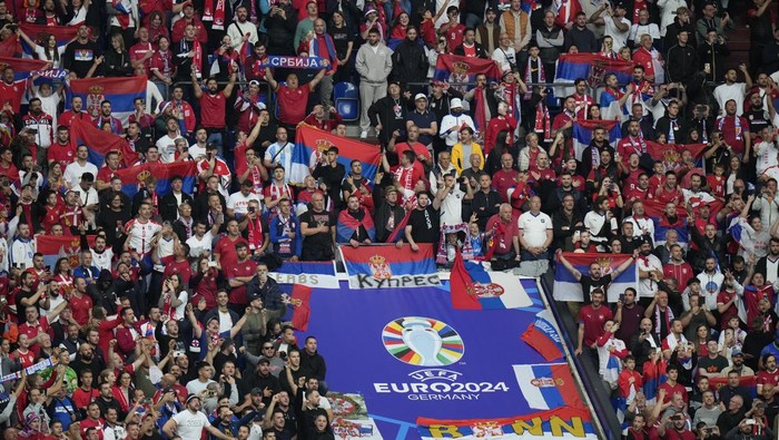 Serbia fans cheer during a Group C match between Serbia and England at the Euro 2024 soccer tournament in Gelsenkirchen, Germany, Sunday, June 16, 2024. (AP Photo/Alessandra Tarantino)