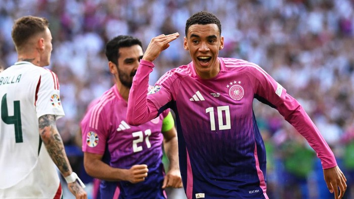19 June 2024, Baden-Württemberg, Stuttgart: Soccer, UEFA Euro 2024, European Championship, Germany - Hungary, Preliminary round, Group A, Matchday 2, Stuttgart Arena, Germanys Jamal Musiala (r) celebrates his goal to make it 1-0. Photo: Marijan Murat/dpa (Photo by Marijan Murat/picture alliance via Getty Images)
