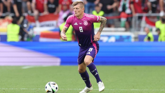 STUTTGART, GERMANY - JUNE 19: Toni Kroos of Germany runs with the ball during the UEFA EURO 2024 group stage match between Germany and Hungary at Stuttgart Arena on June 19, 2024 in Stuttgart, Germany. (Photo by Alexander Hassenstein/Getty Images)