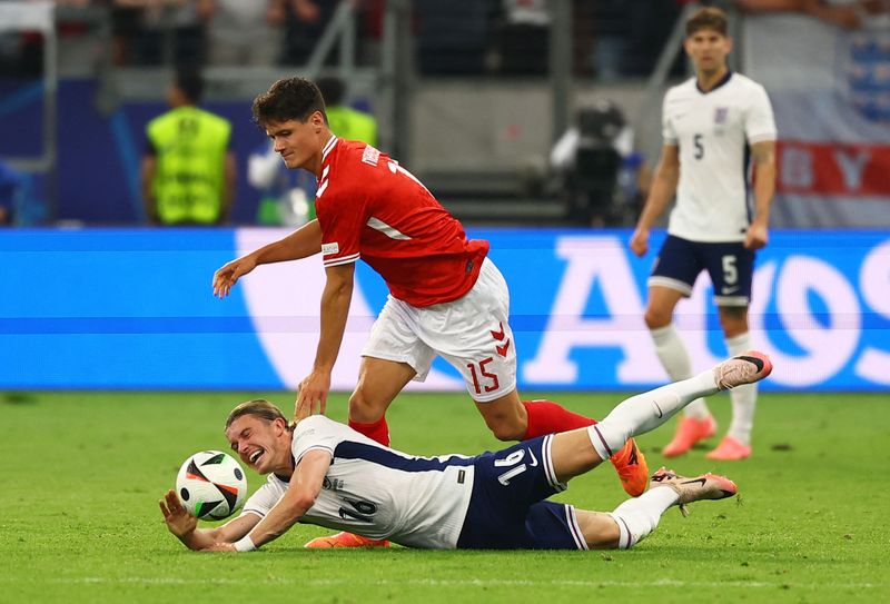 Soccer Football - Euro 2024 - Group C - Denmark v England - Frankfurt Arena, Frankfurt, Germany - June 20, 2024 Denmark's Christian Norgaard in action with England's Conor Gallagher REUTERS/Kai Pfaffenbach