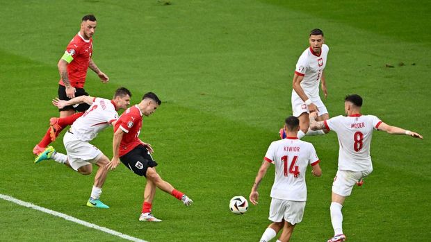 BERLIN, GERMANY - JUNE 21: Christoph Baumgartner of Austria scores his team's second goal during the UEFA EURO 2024 group stage match between Poland and Austria at Olympiastadion on June 21, 2024 in Berlin, Germany. (Photo by Dan Mullan/Getty Images)