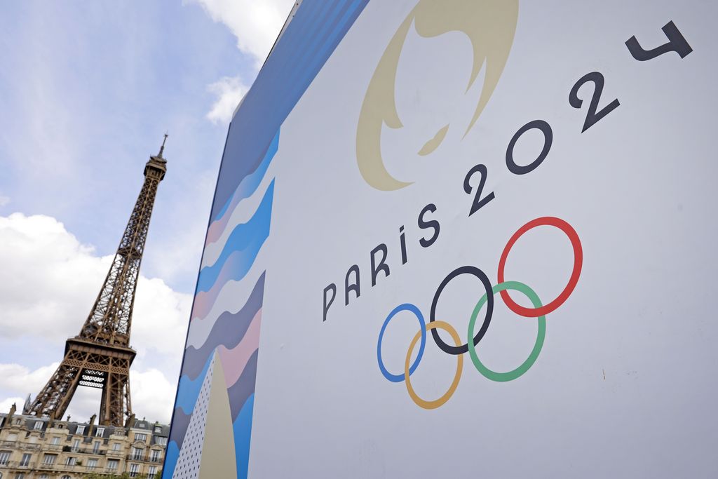 PARIS, FRANCE - JUNE 17: The Paris 2024 logo is displayed near the Eiffel Tower before the start of the Paris 2024 Olympic and Paralympic Games on June 17, 2024 in Paris, France. The city is gearing up to host the XXXIII Olympic Summer Games, from 26 July to 11 August. (Photo by Chesnot/Getty Images)