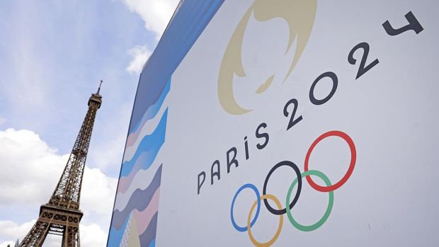 PARIS, FRANCE - JUNE 17: The Paris 2024 logo is displayed near the Eiffel Tower before the start of the Paris 2024 Olympic and Paralympic Games on June 17, 2024 in Paris, France. The city is gearing up to host the XXXIII Olympic Summer Games, from 26 July to 11 August. (Photo by Chesnot/Getty Images)