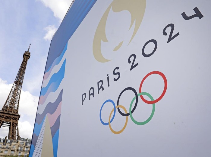 PARIS, FRANCE - JUNE 17: The Paris 2024 logo is displayed near the Eiffel Tower before the start of the Paris 2024 Olympic and Paralympic Games on June 17, 2024 in Paris, France. The city is gearing up to host the XXXIII Olympic Summer Games, from 26 July to 11 August. (Photo by Chesnot/Getty Images)