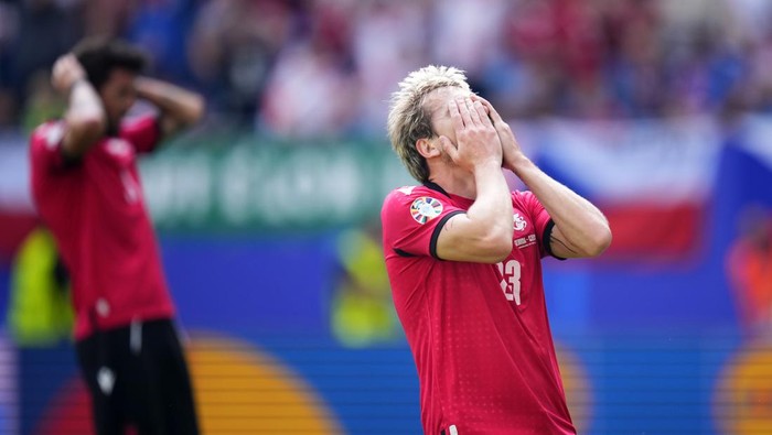Georgias Saba Lobjanidze reacts after a missed chance to score during a Group F match between Georgia and the Czech Republic at the Euro 2024 soccer tournament in Hamburg, Germany, Saturday, June 22, 2024. (AP Photo/Petr David Josek)