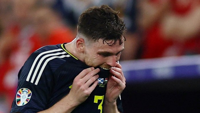 Soccer Football - Euro 2024 - Group A - Scotland v Hungary - Stuttgart Arena, Stuttgart, Germany - June 23, 2024 Scotlands Andy Robertson reacts after being substituted REUTERS/Lee Smith