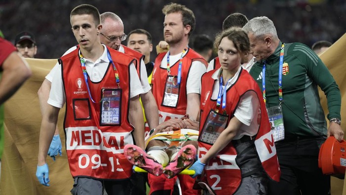 Hungarys Barnabas Varga leaves the pitch on a stretcher after he was injured during a Group A match between Scotland and Hungary at the Euro 2024 soccer tournament in Stuttgart, Germany, Sunday, June 23, 2024. (AP Photo/Antonio Calanni)