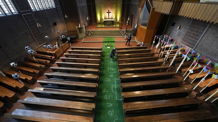 The Emmaus Evangelical Church is decorated with inflated soccer themed balloons and with a green carpet depicting a soccer pitch in Gelsenkirchen, Germany, Sunday, June 23, 2024. (AP Photo/Alessandra Tarantino)