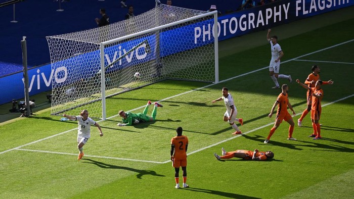 BERLIN, GERMANY - JUNE 25: Patrick Wimmer of Austria celebrates with teammates after an own goal by Donyell Malen of the Netherlands during the UEFA EURO 2024 group stage match between Netherlands and Austria at Olympiastadion on June 25, 2024 in Berlin, Germany. (Photo by Tullio Puglia - UEFA/UEFA via Getty Images)