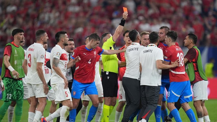 26 June 2024, Hamburg: Soccer: Football, UEFA Euro 2024, European Championship, Czech Republic - Turkey, Preliminary round, Group F, Matchday 3, Volksparkstadion Hamburg, Referee Istvan Kovacs shows Czech Republics Tomas Chory (3rd from right) the red card. Photo: Marcus Brandt/dpa (Photo by Marcus Brandt/picture alliance via Getty Images)