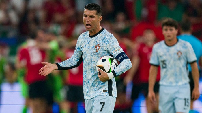 GELSENKIRCHEN, GERMANY - JUNE 26: Cristiano Ronaldo of Portugal reacts after suffering a second score from Georgia during the UEFA EURO 2024 group stage match between Georgia and Portugal at Arena AufSchalke on June 26, 2024 in Gelsenkirchen, Germany. (Photo by Marcio Machado/Eurasia Sport Images/Getty Images)