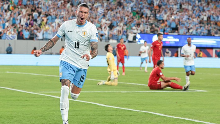 Jun 27, 2024; East Rutherford, NJ, USA; Uruguay forward Darwin Nunez (19) celebrates his goal past Bolivia goalkeeper Guillermo Viscarra (23) during the first half of the Copa America match at MetLife Stadium. Mandatory Credit: Vincent Carchietta-USA TODAY Sports