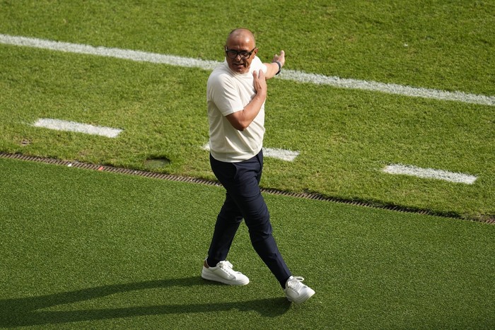 Slovakias head coach Francesco Calzona stands on the sideline during a Group E match against Romania at the Euro 2024 soccer tournament in Frankfurt, Germany, Wednesday, June 26, 2024. (AP Photo/Darko Vojinovic)