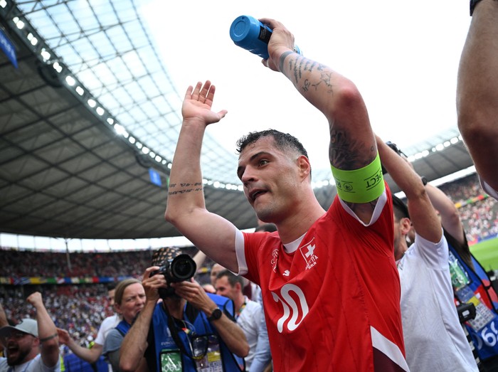 Soccer Football - Euro 2024 - Round of 16 - Switzerland v Italy - Berlin Olympiastadion, Berlin, Germany - June 29, 2024  Switzerlands Granit Xhaka celebrates after the match REUTERS/Annegret Hilse