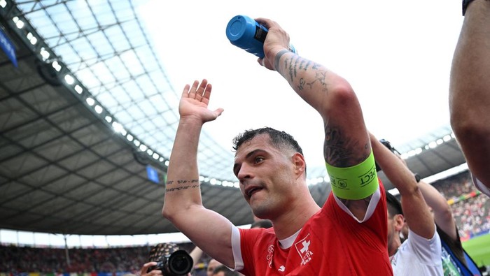 Soccer Football - Euro 2024 - Round of 16 - Switzerland v Italy - Berlin Olympiastadion, Berlin, Germany - June 29, 2024  Switzerlands Granit Xhaka celebrates after the match REUTERS/Annegret Hilse
