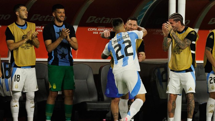 Jun 29, 2024; Miami, FL, USA;  Argentina forward Lautaro Martnez (22) celebrates with forward Lionel Messi (10) after scoring a goal against Peru in the second half during the Copa America group stage at Hard Rock Stadium. Mandatory Credit: Nathan Ray Seebeck-USA TODAY Sports